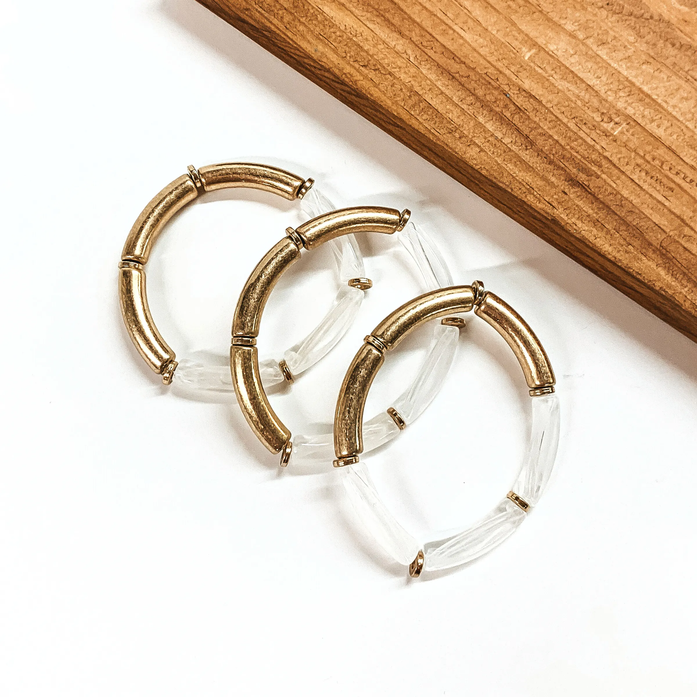 Set of Three Tube Bracelets in Clear and Gold Tone